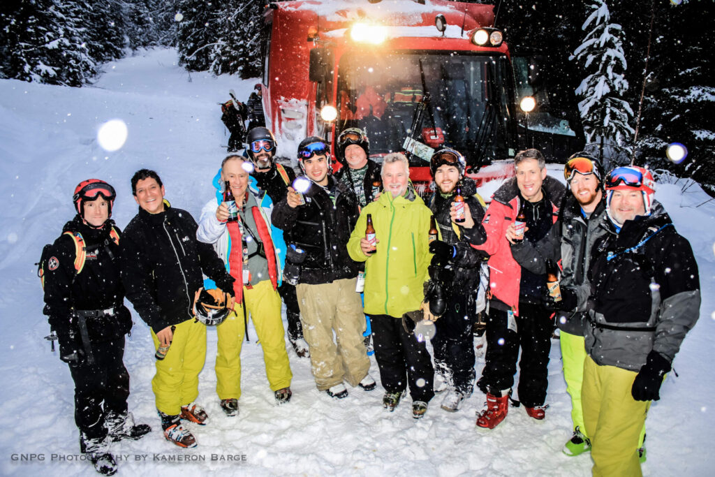 Multi-day cat skiing group posing together in Montana’s Northern Rockies.