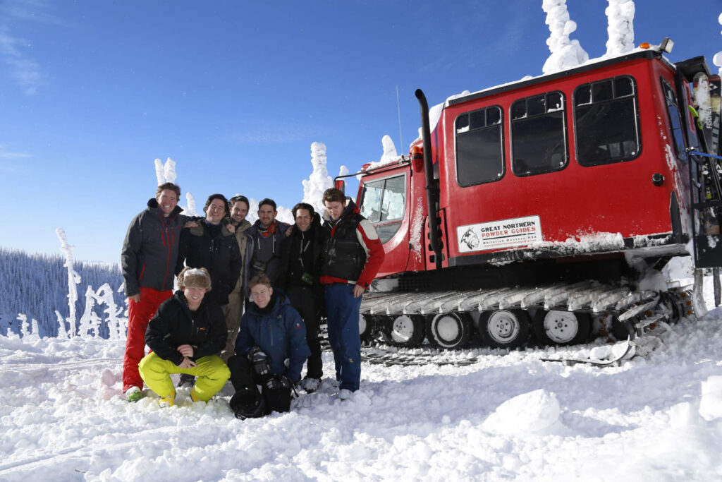 Cat skiing group posing together in Montana’s Great Northern Powder Guides