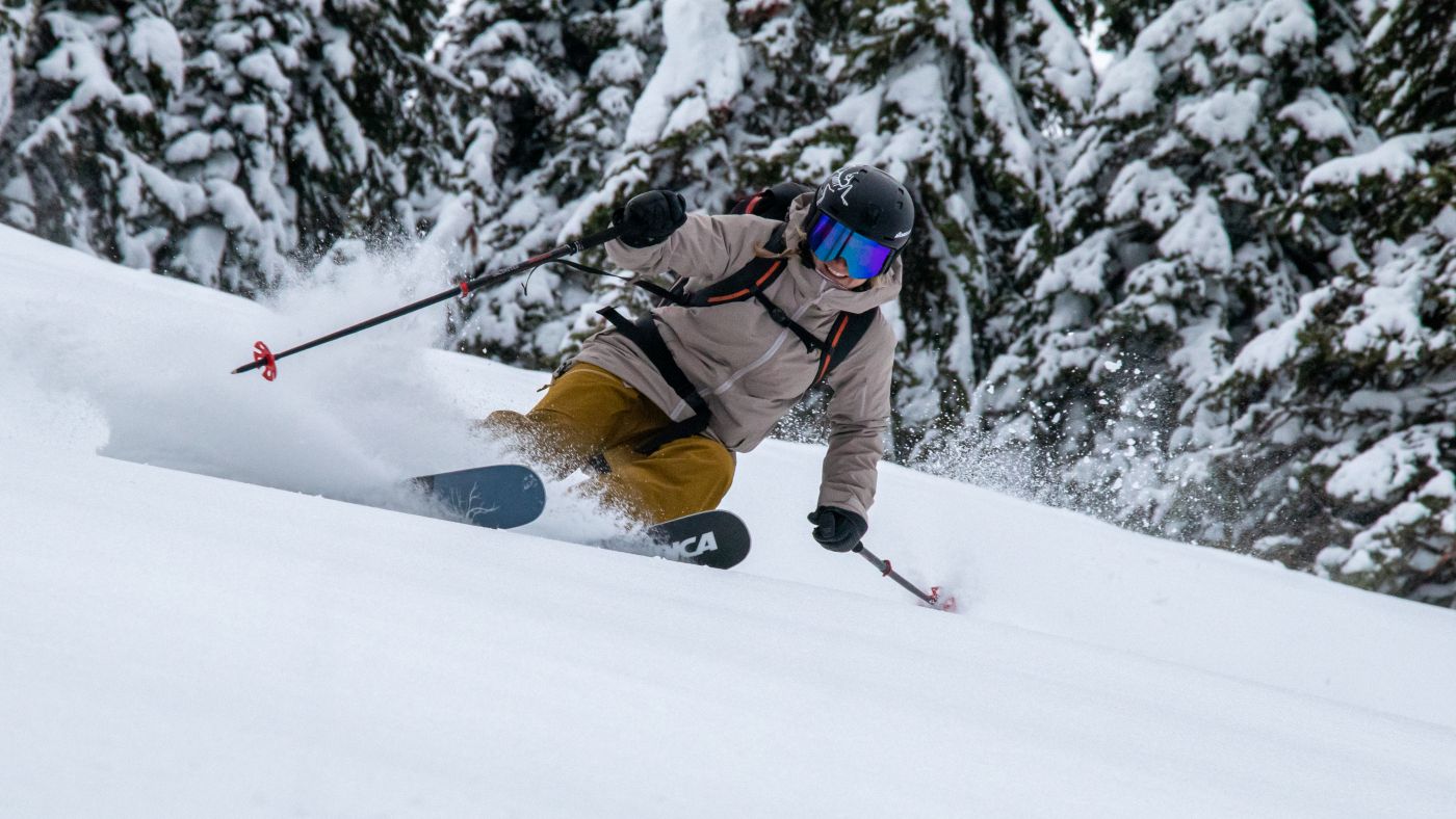 Great Northern Powder Guest making sharp turns through fresh powder 