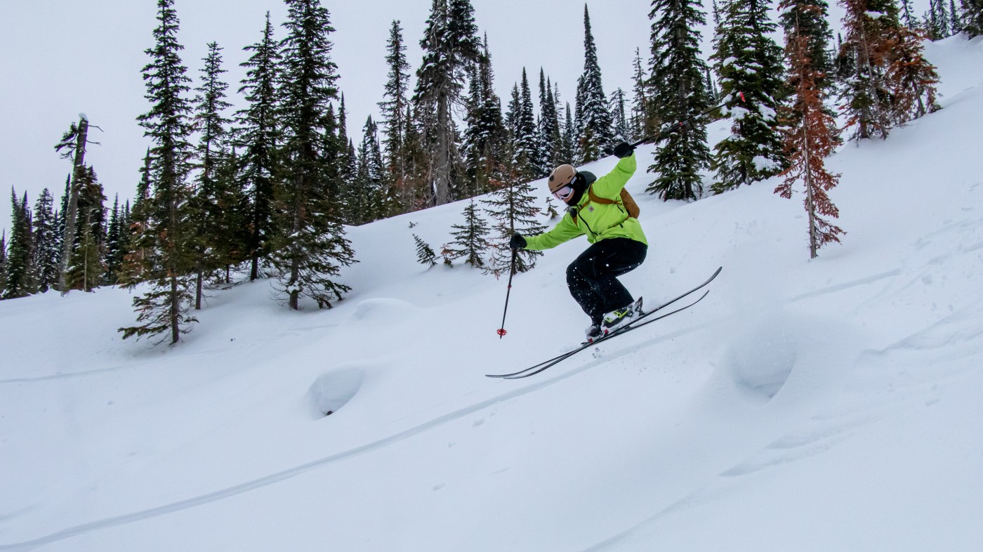 Skier descending powder pillows at GNPG resort