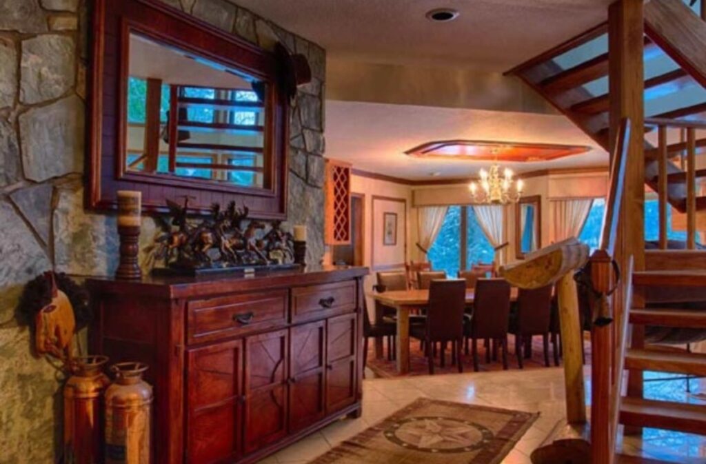 Ranch dining area with long wooden tables and rustic mountain décor.